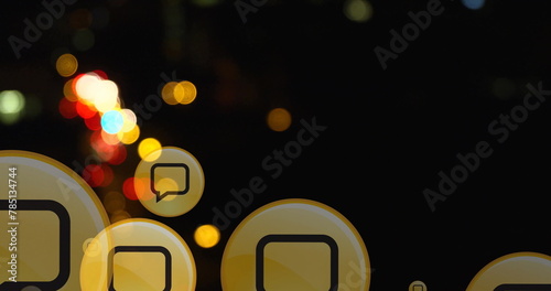 Image of speech bubble in circles over high angle view of blurred vehicles moving on street