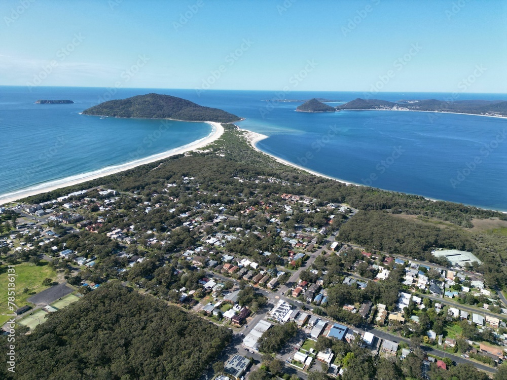 Beautiful view of small town on an island with green trees under the blue sky