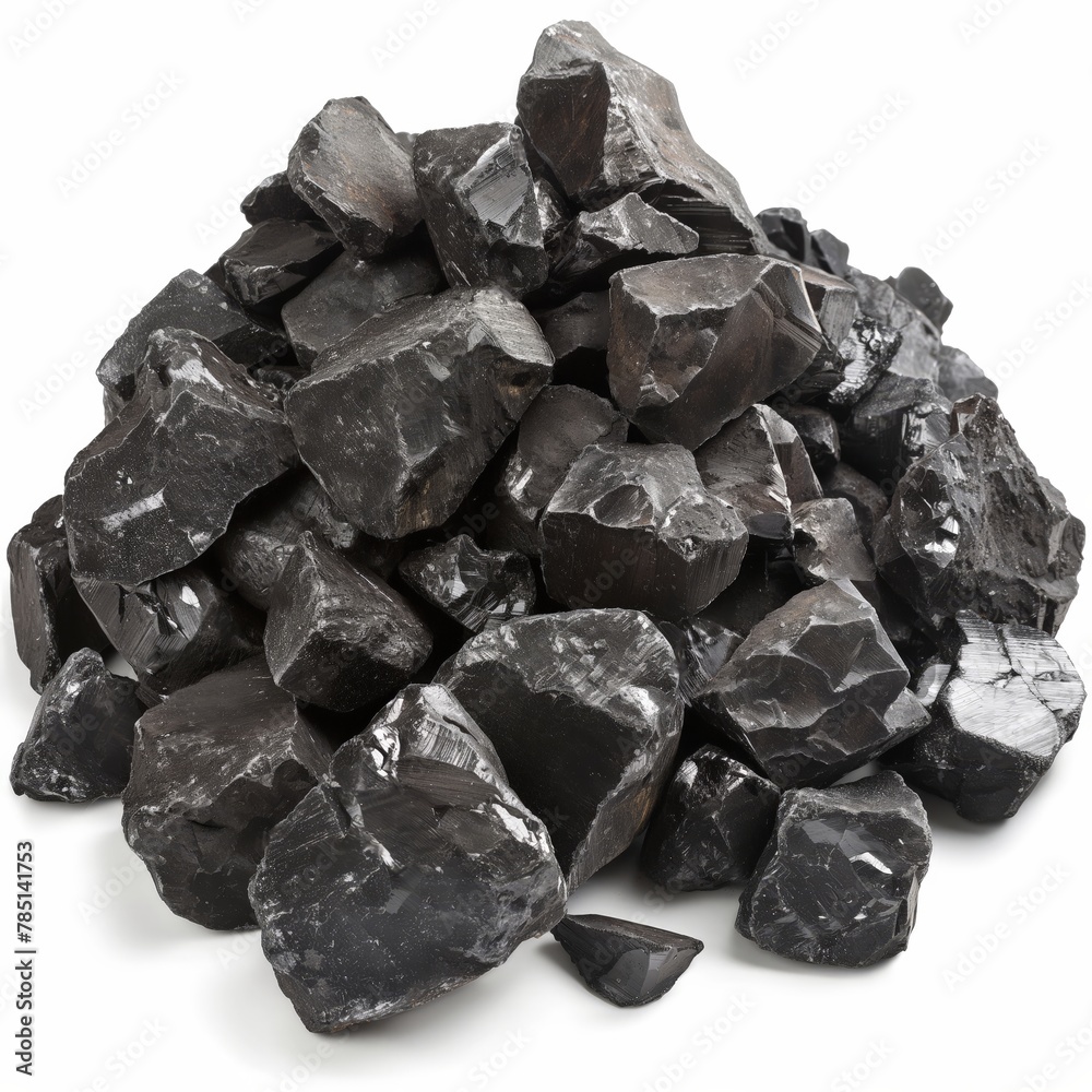 A heap of natural black coal pieces with reflective surfaces isolated on a white background.