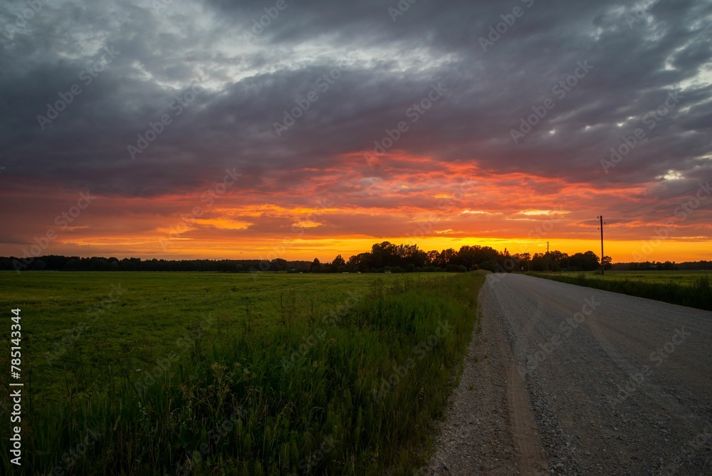 View of a sunset in the field and road