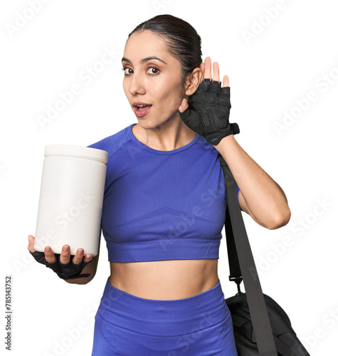 Fitness young Caucasian woman with protein and bag on studio background trying to listening a gossip.