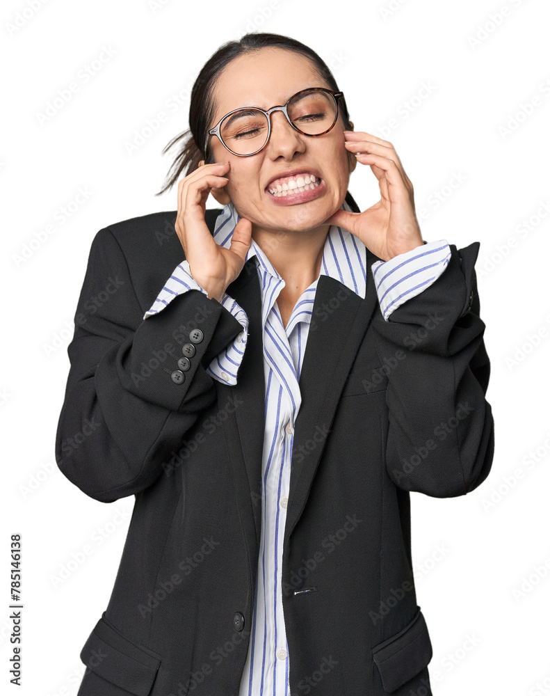 Confident young Caucasian businesswoman on studio background covering ears with hands. Confident young Caucasian businesswoman on studio background covering ears with hands.