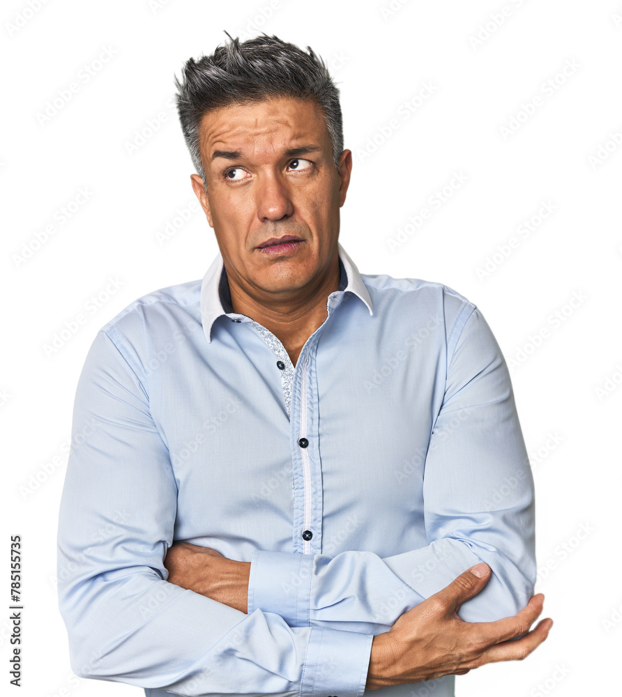 Middle-aged Latino man tired of a repetitive task. Middle-aged Latino man tired of a repetitive task.