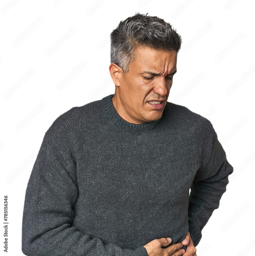 Fototapeta premium Middle-aged Latino man having a liver pain, stomach ache.