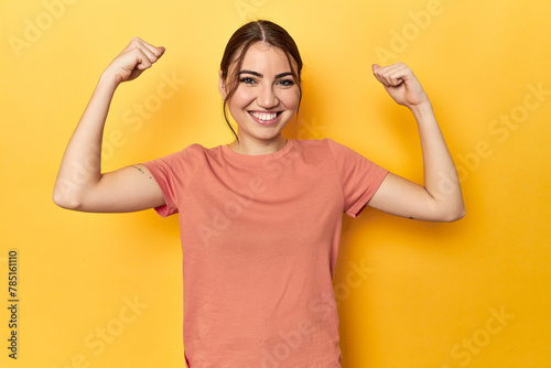 showing strength gesture with arms, symbol of feminine power