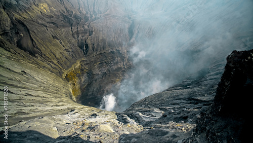 The steaming active volcano crater of the Bromo on the Java island photo
