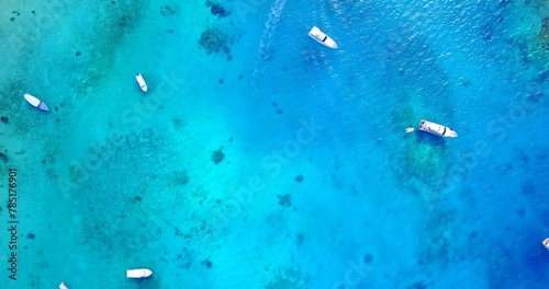 Aerial view of boats in the turquoise ocean