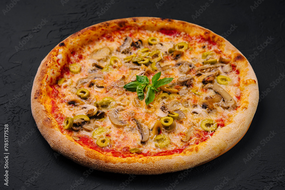 Freshly baked mushroom and olive pizza on black background Freshly baked mushroom and olive pizza on black background