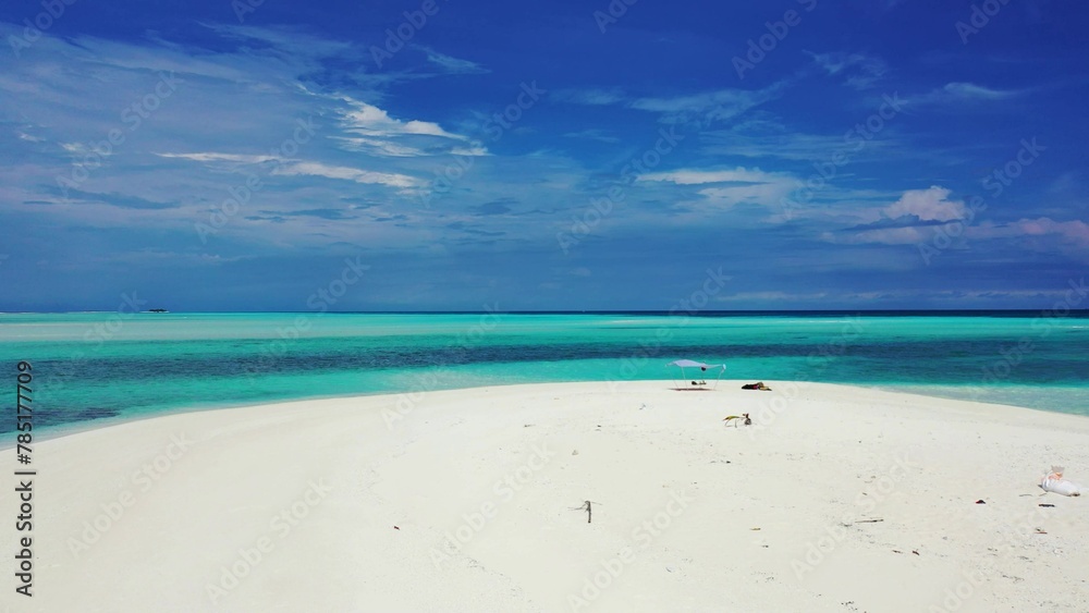 Scenic view of a sandy beach with turquoise water in the Maldives