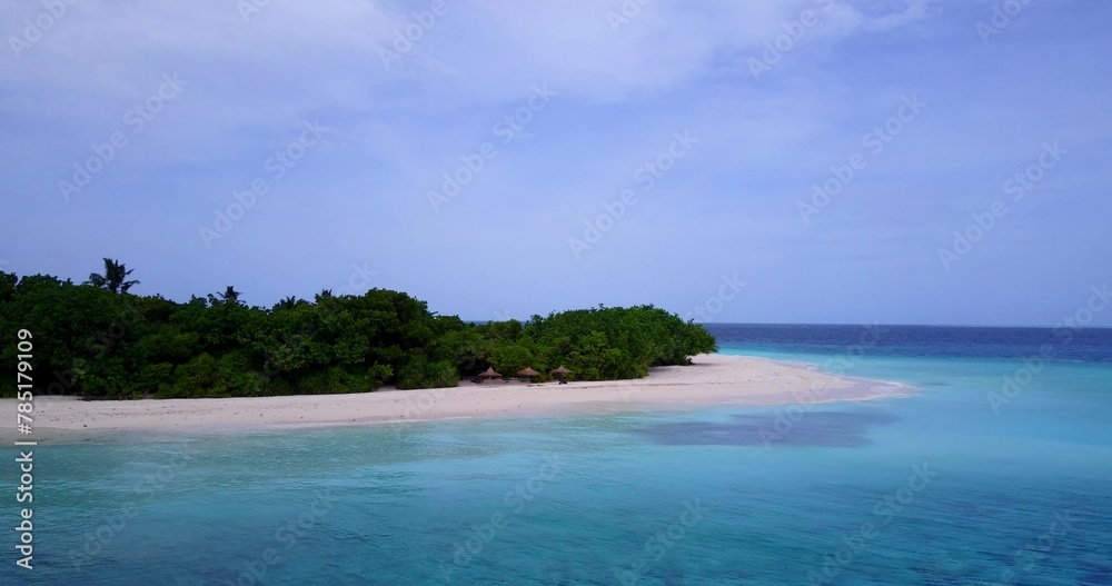 Beautiful view of a sandy sea beach under a blue sky in Asia