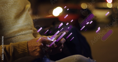 Image of purple light trails over caucasian man using smartphone