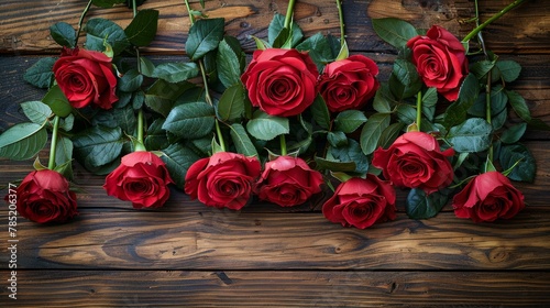 A Bunch of Red Roses on a Wooden Table