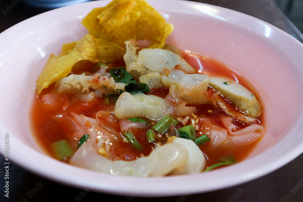 noodles with fish ball , jellyfish and fried wonton noodles with fish ball , jellyfish and fried wonton