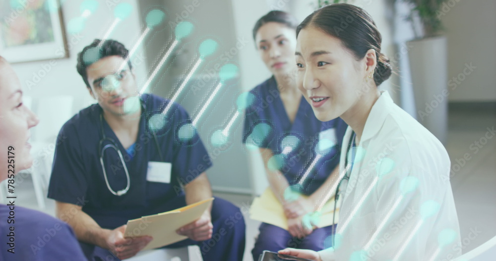 Image of dna strand over diverse doctors at hospital Image of dna strand over diverse doctors at hospital