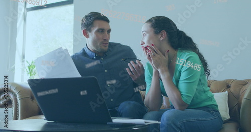 Image of data processing over caucasian couple using laptop photo