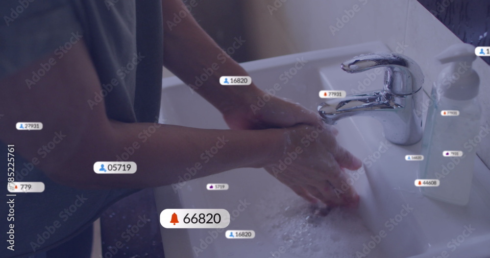 Fototapeta premium Image of media icons over caucasian woman washing hands