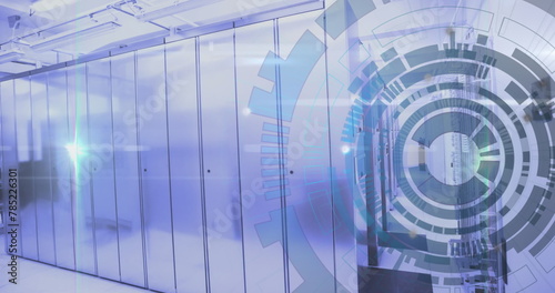 Image of loading circles over lens flare against server room in background