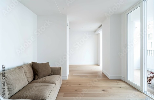 A living room view with a couch  white wall  empty wall  for a artwork mockup display no frame on the wall