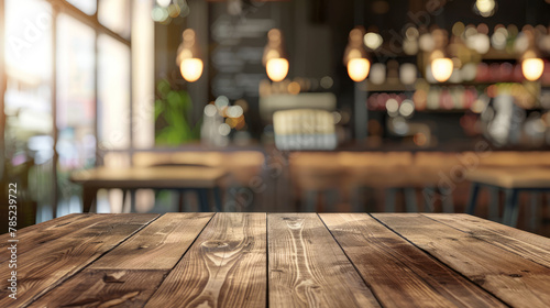 image of wooden table in front of abstract blurred background of resturant lights