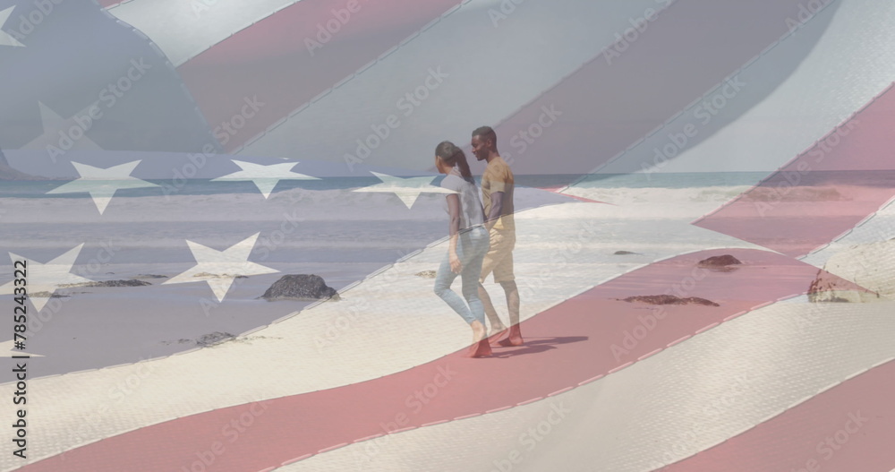 Naklejka premium Image of american flag moving over couple holding hands and walking on beach
