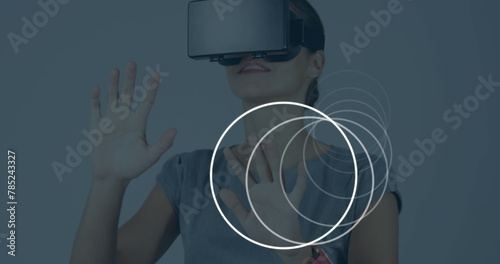 Image of scopes scanning over businesswoman wearing vr headset