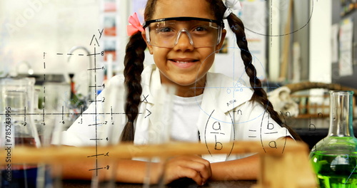 Image of mathematical formulae over smiling schoolgirl