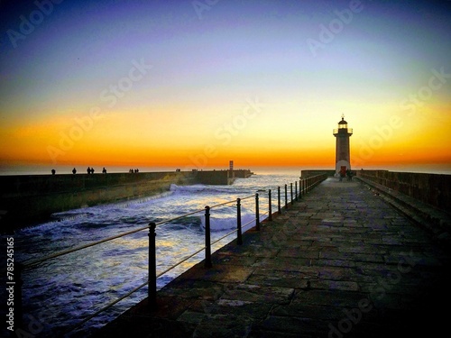 Sunset at the ocean pier with a lighthouse, Porto, Portugal, January 2019