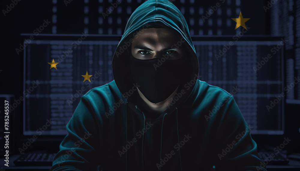 Hacker in a dark hoodie sitting in front of a monitors with Alaska flag and background cyber security concept Hacker in a dark hoodie sitting in front of a monitors with Alaska flag and background cyber security concept