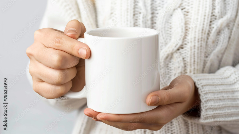 Girl is holding white mockup mug ceramic cup in hand isolated on white background Girl is holding white mockup mug ceramic cup in hand isolated on white background