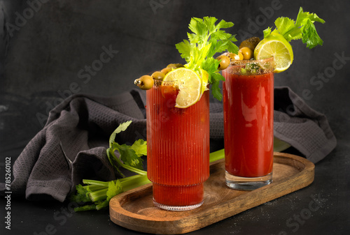 Bloody Mary cocktail in a glass with celery sticks