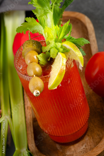 Bloody Mary cocktail in a glass with celery sticks