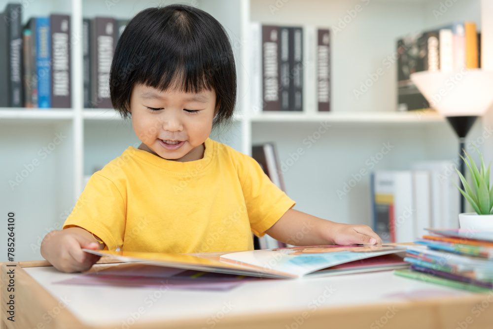 Happy Asian children relax read book at home. daughter and reading a story. learn development, childcare, laughing, education, storytelling, practice, imagine, reduce addiction mobile phone Happy Asian children relax read book at home. daughter and reading a story. learn development, childcare, laughing, education, storytelling, practice, imagine, reduce addiction mobile phone