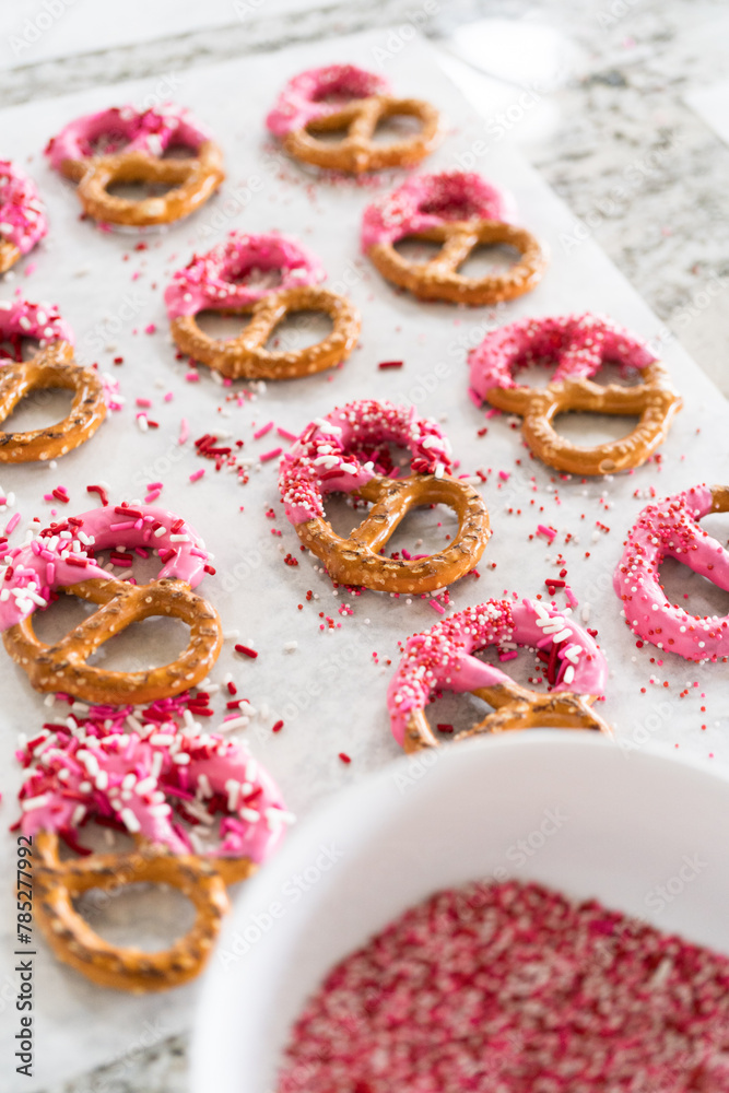 Homemade Gourmet: Delightful Pretzels Adorned with Pink Chocolate and Sprinkles