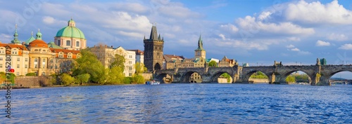 Panorama of old town with Charles Bridge on Vltava river and Old Town Bridge Tower, famous tourist destination in Prague, Czech Republic