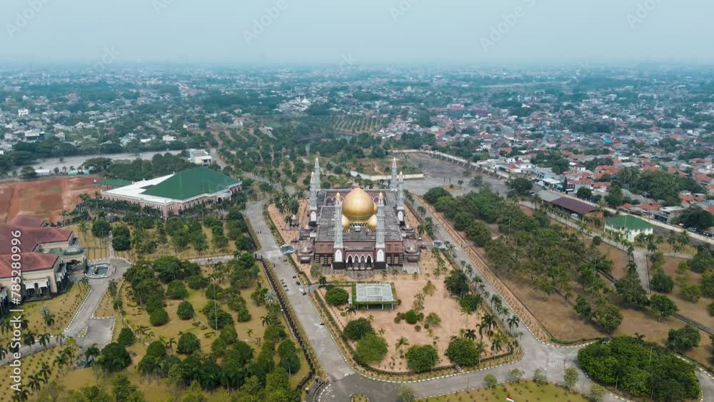 Aerial view of the Golden Dome Mosque or Masjid Kubah Emas which is a landmark of Depok City. Mosque with golden dome.