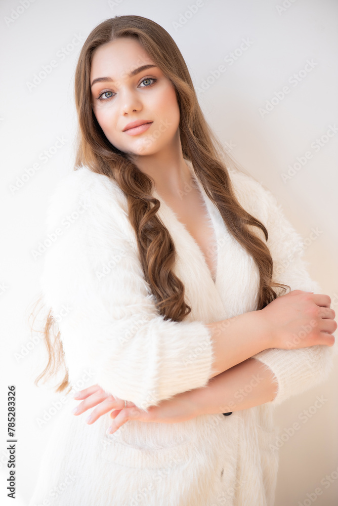 young woman with long brown hair and beautiful smile.