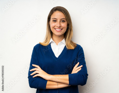 Young blonde woman on isolated white background with arms crossed frontal posing smiling happy cherful lady photo