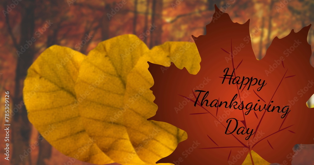 Fototapeta premium Image of happy thanksgiving day text over red and orange autumn leaves in park