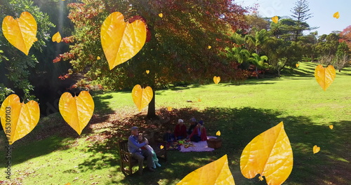 Image of orange autumn leaves falling in park