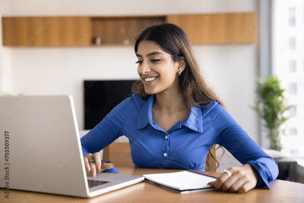 Cheerful young Indian student girl watching educational webinar, online ...