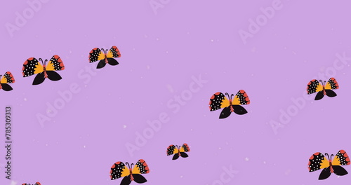Digital image of multiple butterfly icons and white particles floating against purple background