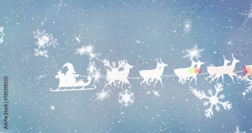 Image of santa claus in sleigh with reindeer over snow falling in winter scenery