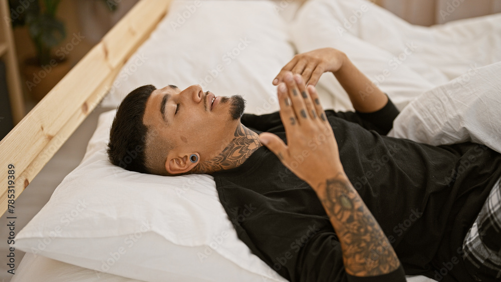 Young latin man's morning ritual, sweating, relaxing and ditching his bedsheet in his cozy bedroom Young latin man's morning ritual, sweating, relaxing and ditching his bedsheet in his cozy bedroom