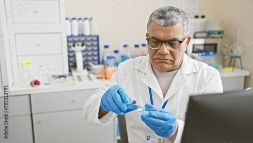 A mature man in a lab coat conducts experiments in a well-equipped laboratory.
