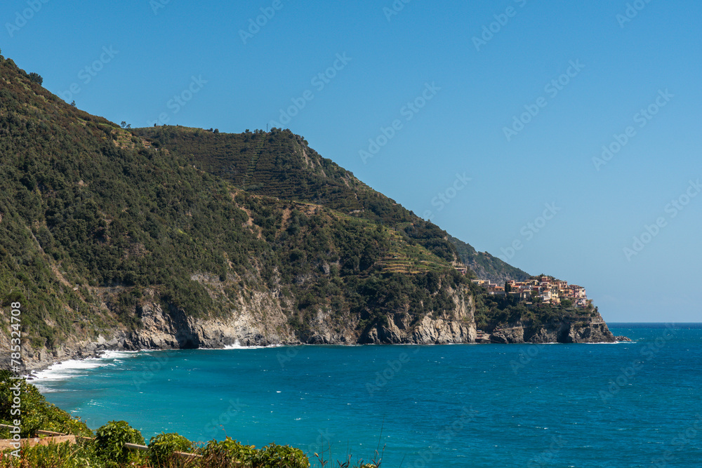 view to Manarola town in a distance, seen from Corniglia train station