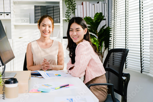 The young group of Asian attractive businesswomen adviser in casual sitting and discussing during the meeting on working table at office. Professional business adviser. Businesswomen in a meeting.