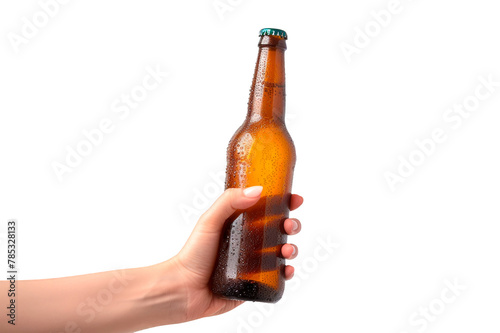 Woman's hand holding a brown bottle of fresh beer with drops isolated on a cutout PNG transparent background
