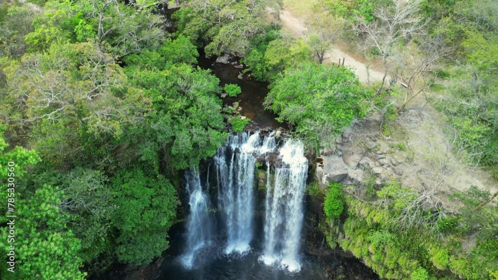Drone shot of Llanos de Cortes waterfall located in Bagaces, Guanacaste, Costa Rica. Drone shot of Llanos de Cortes waterfall located in Bagaces, Guanacaste, Costa Rica.