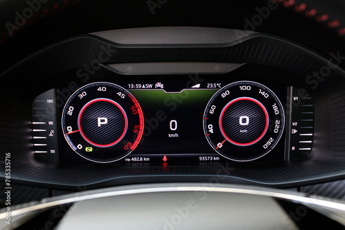 Sports car digital speedometer and tachometer. Sports car dashboard. Close-up view of the modern car dashboard. Arrow of speedometer of supercar.