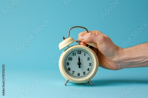 hand turns off the alarm clock